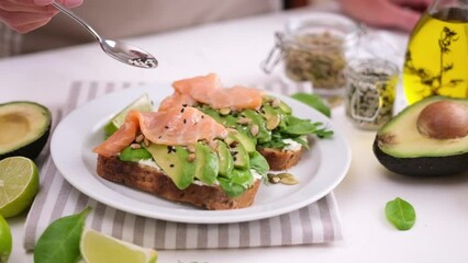 Wall Mural - healthy breakfast or snack - making soft cheese, avocado and salmon sandwich