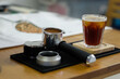 Ground coffee in Espresso Machine Portafilter and macaron tamper