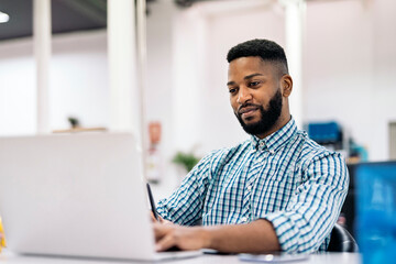 Wall Mural - African Man Working in Office