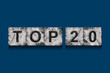 Top 20, words, isolated on a dark blue background. Alphabet on stone blocks.Rating. Rating concept.