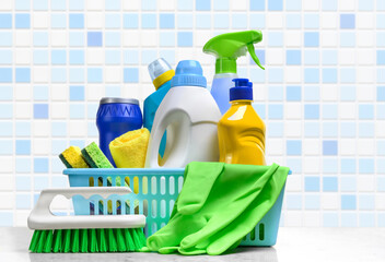 Wall Mural - Cleaning supplies in plastic box on white table in the bathroom