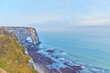 The cliffs of Etretat provide stunning views of the sea.