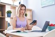 © Krakenimages.com - Young woman sitting on table studying at home