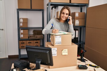 Canvas Print - Young blonde woman ecommerce business worker talking on the smartphone at office