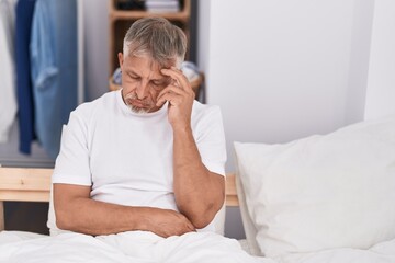 Sticker - Middle age grey-haired man stressed sitting on bed at bedroom