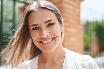 Sticker - Young caucasian woman smiling confident standing at street