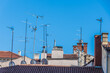 roofs with antennas and chimneys in the old town of rovinj, croatia