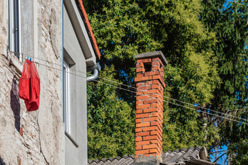 chimney and clothes line on the wall in the old town of pula, croatia