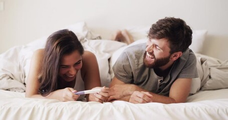 Canvas Print - Happy, wow and surprised couple with pregnancy test at in bed at home. Man and woman excited for good news and excited for child and to be parents while relax, hug and laugh in bedroom together