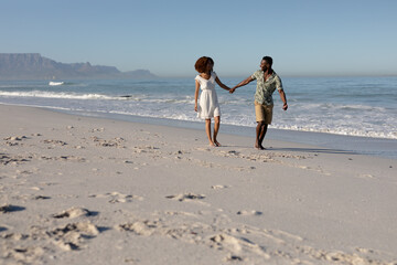 Happy couple spending time together on the beach