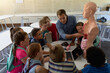 © wavebreak3 - Male teacher using an human anatomy model to teach