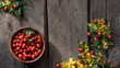 Rosehip berries on wooden rustic background. rosehip branches. Banner