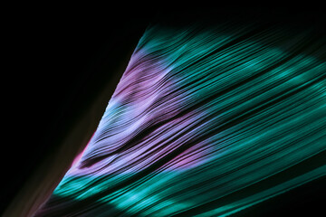 Fototapete - Close up Beautiful book pages in the multi color light on a night. Background pattern for design. Macro photography view.