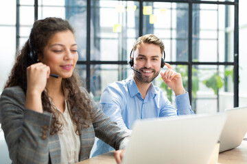 Sticker - Portrait of call center worker accompanied by his team. Smiling customer support operator at work.