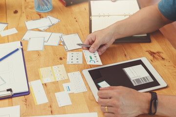 Wall Mural - ux ui concept, graphic designers work together with ux ui designer planning application template lay