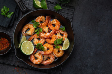 Wall Mural - spicy roasted shrimps in cast iron pan
