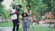 © Me studio - African children and families happily play outdoor sports in the garden.Man jogging with nature in the garden.On summer vacation, the family happily took a walk in nature.