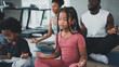© Me studio - children exercise yoga with family at the gym.The lifestyle of a young body is to take care of one's body.Children wear sports wear to exercise fluently.