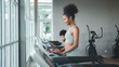 © Me studio - Healthy woman running on sports treadmill with daughter.Exercise for health and body health, to practice sports.children running on sports treadmill in gym.