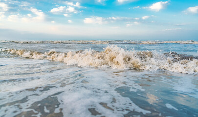 Wall Mural - Waves on beach and blue sky with clouds landscape