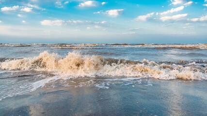 Wall Mural - Waves on beach and blue sky with clouds landscape