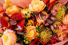 Red Pink Orange Autumn Colorful Fall Bouquet. Beautiful Flower Composition With Autumn Orange And Red Flowers. Flower Shop And Florist Design Concept. Close Up, Floral Background