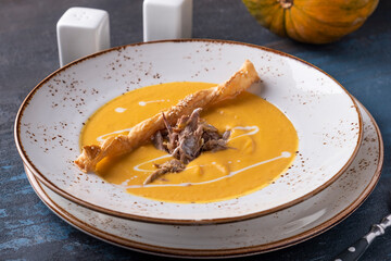 Wall Mural - Tasty pumpkin soup with duck. Autumn soup