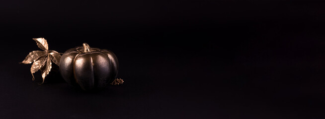 Gold and black luxury pumpkin. Minimalist banner good for thanksgiving and Halloween.