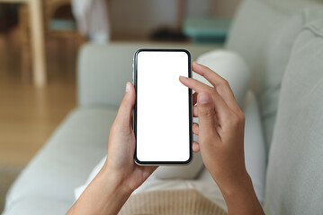 Aufkleber - close-up hand using phone showing white screen in living room