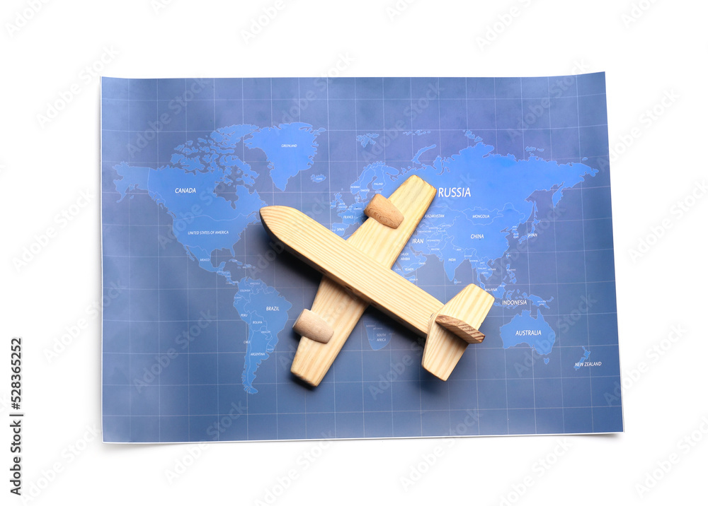 World map and wooden airplane isolated on white background