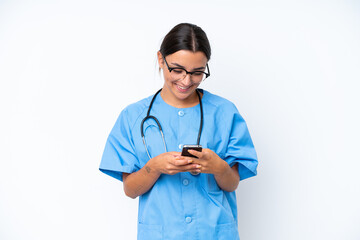 Sticker - Young nurse woman isolated on white background sending a message with the mobile