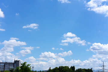 Wall Mural - clear blue sky background with white clouds