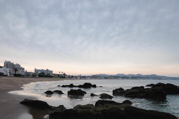 Sticker - Scenic view of a rocky coast with a bright sunset in the sky in Miura, Japan