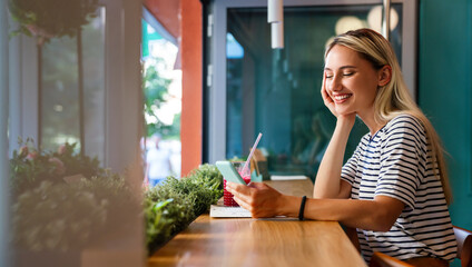 Wall Mural - Portrait og happy woman using mobile phone for work, study or social media. People technology