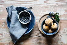 Fresh blueberries and bowl of homemade peanut ice cream