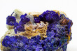 Macro blue azurite cluster on white matrix isolated crystal on white background 