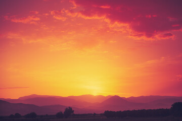 Amazing bright orange sunset over mountain range. Beautiful nature scenery background. Tourism and travel concept image. Copy space.