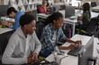 © ReeldealHD images - High school students computer programming in class