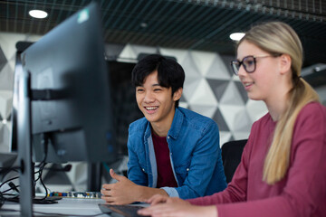High school students learning how to code in class