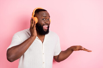 Wall Mural - Photo of crazy excited person enjoy listen favorite playlist isolated on pink color background
