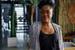 Portrait of confident African American female entrepreneur posing in office