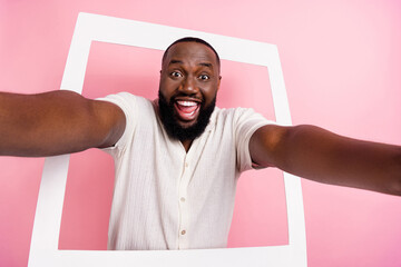 Wall Mural - Photo of funky excited guy dressed white shirt tacking selfie white pictute isolated pink color background