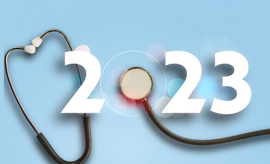 happy new year 2023. Number 2023 with Stethoscope isolated background. health medical concept 