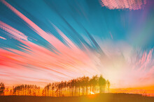 Moving Clouds Trails In Morning Sky. Sunrise Sky Natural Background. Bright Sunlight Shining Through Trees. Amazing Effects Of Smeared Fantasy Clouds. Abstract Colors. Long Exposure. Flight Of Fancy.