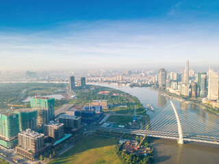 Aerial view of Ho Chi Minh City skyline and skyscrapers on Saigon river, center of heart business at downtown. Morning view. Far away is Landmark 81 skyscraper