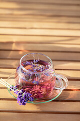 Wall Mural - Glass cup of lavender tea.