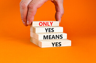 Wall Mural - Only yes means yes symbol. Concept words Only yes means yes on wooden blocks on a beautiful orange table orange background. Businessman hand. Business, psychological only yes means yes concept.