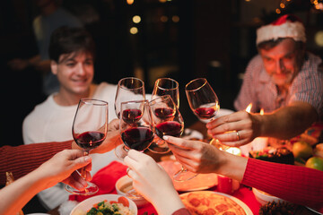 Group of  Happy Family enjoying celebrating Christmas or New Year's eve party with champagne at home. Eve family gathering meeting dream in Christmas or New Year festivals.