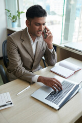 Wall Mural - businessman checking agreement on laptop