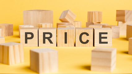 Wall Mural - the word price written on wooden cubes on yellow background